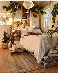 This Is The Perfect Bedroom With Natural Wood Cream Colors And Lots Of Green Plants The Bed Is Up On Wooden Pa Bedroom Design Home Decor Boho Bedroom Decor