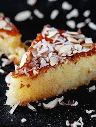 Basbousa An Easy Middle Eastern Semolina Cake Drenched In Cinnamon Syrup And Topped W Coconut And Shaved Basbousa Recipe Best Basbousa Recipe Semolina Cake