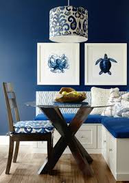 This space uses dark blue walls as a backdrop for the red accents scattered throughout the room. 24 Blue Interior Wall Paint Ideas For Every Room In The Home Coastal Decor Ideas Interior Design Diy Shopping