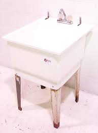 used white plastic utility mop sink w