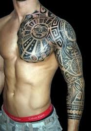It is done by piercing the skin with a sharp object that has been dipped in ink or dye. Looks Like A Mayan Robot Tribal Arm Tattoos Tribal Chest Tattoos Tribal Tattoos