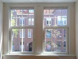 Kunststof Kozijnen Met Roeden Tussen Het Glas Kozijn Den Haag Nieuwbouw