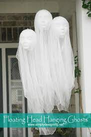 Use fishing line to suspend the ghosts, using extra lengths of fishing line or clear thread to hold them in place if necessary. Diy Halloween Decorations Floating Head Hanging Ghosts Simply Designing With Ashley
