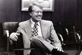 Here's our weekly Sunday picture to brighten your day. #NPS #Carter #Sunday  #Brighten Image description- Governor Carter smiles while sitting in a  chair within the Georgia State Capitol. Photo Courtesy of Columbus-Ledger