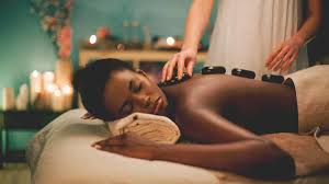 Hot masseuse relieves client's tension. 6 Benefits Of Hot Stone Massage