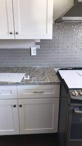 Santa Cecilia Light Granite Taupe Glass Backsplash White Cabinets White Kitchen Backsplash White Modern Kitchen Light Gray Cabinets
