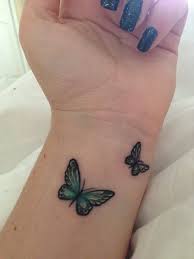Beautiful Green Butterfly Tattoos On Left Wrist Butterfly Wrist Tattoo Tattoos Butterfly Tattoos For Women