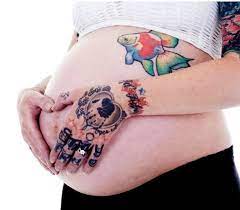 Can You Get A Tattoo While Breastfeeding Update 2021 Tattoos While Pregnant Tattoos While Breastfeeding Skull Hand Tattoo