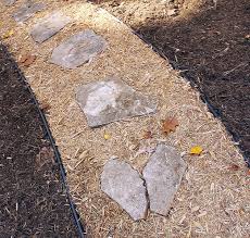 Here, the path has been laid in a. How To Create An Inexpensive Mulch And Stone Walkway