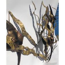 This abstract metal wall art & sculpture captures the interplay of the highlights and shadows and creates a new three dimensional sense of movement as your view it from different angles. Mid Century Modern Metal Wall Art Fish Seaweed Chairish