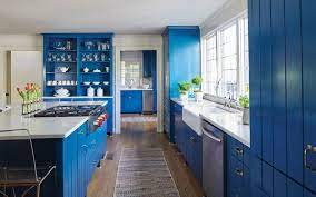 White arrow the idea behind this historic row house remodel by white arrow was to create a fresh and contemporary vibe without sacrificing the home's vintage charm. Blue Cabinets Add A Pop To White Quartz Countertops Surface One