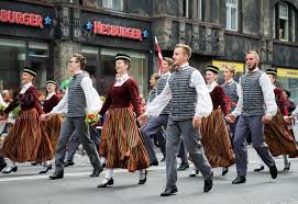 Latvians share a common latvian language, culture and history. Riga Latvia July 01 2018 People In National Costumes At The Latvian National Song And Dance Festival Celebration Procession Throughout The Streets Of Riga Participants Showing Off Their Rich Folk Costumes Will Walk