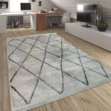 Ein teppich ist, anders als ein teppichboden, nicht dazu gedacht, den boden eines raumes von wand zu wand mit einem textilen fußbodenbelag auszulegen. Teppich Wohnzimmer Rauten Fransen Skandi Teppich De