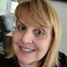 What are the titles of the children's books about an alligator and popcorn  from Dr. Buchanan's lobby?