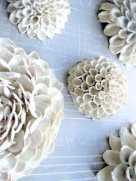 These exquisite handmade ceramic floral objects, inspired by nature, are the perfect summer garnish for dinner tables, shelves, and side tables. 21 Best Ceramic Wall Decor Ideas Ceramic Wall Decor Wall Decor Ceramic Flowers
