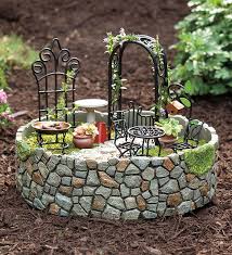 It can be as large as you want it to be when this is all put together, it looks like the fairy spends her time flitting from her home in the tree to tend to her lovely garden in the container down. Goodshomedesign