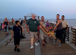 The fishing pier has always been a hot spot in the resort city of virginia beach and is located at 15th street almost directly in the center of the boardwalk. Endangered Sea Turtle Hooked And Rescued At Juno Beach Fishing Pier Loggerhead Marinelife Center
