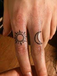 56 Wonderfully Artistic Sun And Moon Tattoo Ideas For Every Taste Finger Tattoos Tattoos Moon Tattoo Ideas