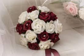 A burgundy/peach wedding bouquet with david austin juliet, dusty pink roses and burgundy dahlia's. Bridesmaids Burgundy And Ivory Rose Wedding Bouquet The Artificial Flowers Company