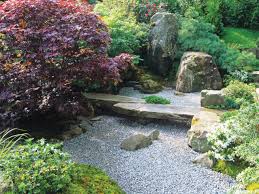 The Careful Landscaping In A Japanese Garden Invites One To Stop And Reflect A Large Flat Stone Serves As A Japanese Rock Garden Japanese Garden Japan Garden