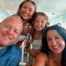 Can I add new chicks to a broody mom after a couple of weeks and how can I  ensure their safety from predators?