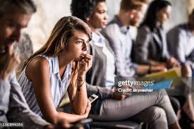 People sitting together looking worried