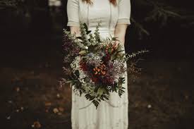 Bridal bouquet for a rustic fall wedding, made with flowers, cattails, wheat, pine cones and a deer antler. 10 Bohemian Wedding Bouquets For Any Style Wedding