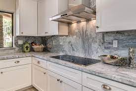 With its characteristic gray veining, marble countertops are a natural match for gray kitchen cabinets. White Marble Kitchen Ideas Beautiful Designs Designing Idea