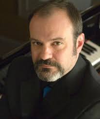 Former U of I orchestra conductor alleges sexual harassment, discrimination 