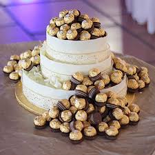 Three Tier Ferrero Rocher Cake A Wedding Tale Ferrero Rocher Cake Cake Occasion Cakes