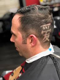 We're Not Gonna Take It: L-S teacher gets hair cut for charity