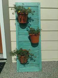 Diy Shutter With Flower Pots Attached Using Zip Ties Patio Art Diy Shutters Garden Crafts