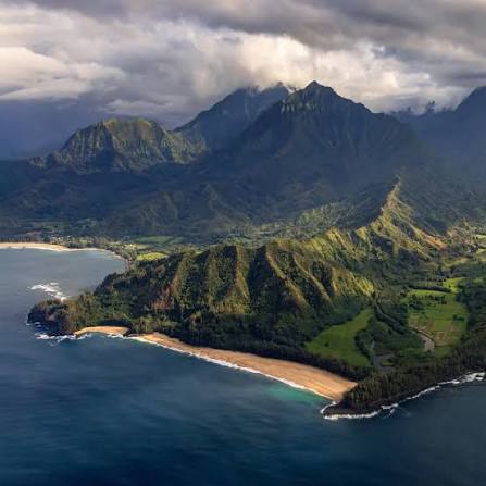 A brief clearing in the rain transforms the island of Kauai into a dramatic show of light and shadow.
