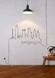 How to hide electric and power cords and cables from tvs, computers, and electronic devices on a tv stand, on the wall, or on a desk, list of products. Why Hide Your Cables And Cords When You Can Turn Them Into Beautiful Wall Art