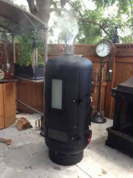 A Backyard Smoker Made From A Discarded Water Pressure Tank And Other Reclaimed Parts Like Oven Door Glass A Bbq Grill Smoker Backyard Smokers Barbecue Smoker