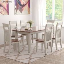 This rectangular rubber wood table is available with a buttermilk and cherry finish and beveled tabletop. Chimay Wooden 6 Seater Dining Table Set Decornation