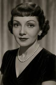 Claudette Colbert; beauty, comedy & style.
