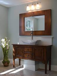 This look is a bit of a throwback to a simpler time in bathroom design, but if one is attempting to attain a vintage look, a quilt rack is certainly the way to go. Wooden Bathroom Vanity With Topmount Bathroom Sink Below Wood Framed Bath Mirror Bathroom Astonishing Bathroom Color Elegant Bathroom Antique Bathroom Vanity
