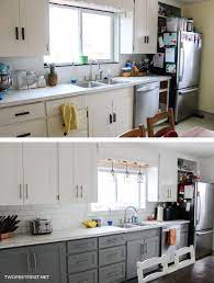 Paint the lower cabinets a darker shade than the uppers. Update Kitchen Cabinets Without Replacing Them By Adding Trim