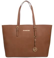#mk #michaelkors how to spot fake michael kors bag michael kors bags have become synonymous with saffiano leather. How To Identify A Fake Michael Kors Jet Set Shiny Syl Blog