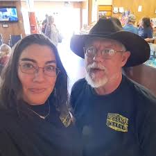 Collector Mr Love, sharing his knowledge of barbwire with visitors from  France