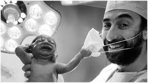 Viral video from indonesia shows workers repacking face masks in unhygienic setting, allegedly for resale the video caption even claimed that the face masks were used from a hospital and. Viral Uae Doctor Shares Pic Of Newborn Baby Yanking His Mask Off Internet Sees It As Ray Of Hope