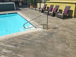 10 pool deck ideas that will transform a dull boring patio into a vibrant, attractive and safe place to enjoy and relax, from travertine to artificial grass. Faux Wood Look For Pool Deck