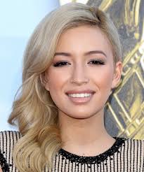 She started coloring her hair darker when she realized hollywood casting agents couldn't quite wrap their heads around a voluptuous latina with an accent and blonde hair. Christian Serratos Long Wavy Light Ginger Blonde Hairstyle With Light Blonde Highlights