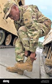 Spc. Walter Thomas, an infantry man with 1st Battalion, 6th Infantry  Regiment, puts