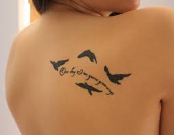 Awesome flying bird tattoo for men's back. Bird Tattoos With Quotes Quotesgram