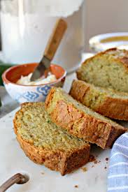 Close Up Shot Of Sliced Zucchini Bread With Butter In A Small Bowl In Background In 2020 Easy Zucchini Bread Recipes Dessert Bread Zucchini Bread