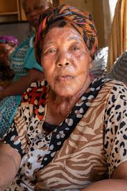 Last week we visited the home of Hilda Mgaga to celebrate her 80th  birthday. Hilda welcomed us with open arms and was happy with her basket of  treats. She was surrounded by