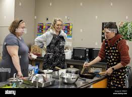 Lora Owen, left, and Melissa Dunkerley, right, both Marine Corps Air  Station Iwakuni residents, pose for a photo during a local cooking class in  Iwakuni City, Japan, Feb. 5, 2019. Station residents