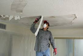 Mix one part vinegar to ten parts water and spray it on the ceiling. Removing A Textured Ceiling Ceiling Texture Popcorn Ceiling Remove Textured Ceiling